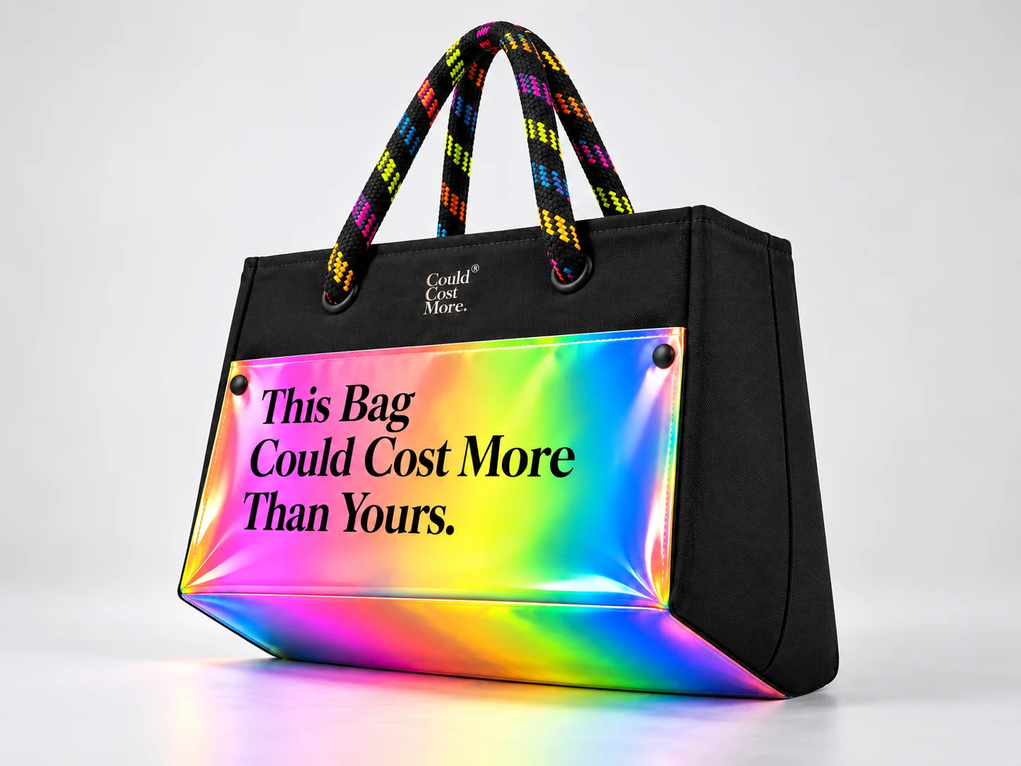 The finished bag: black canvas, rope handles and the panel with the phrase.